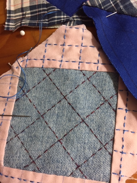 Starting quilting on the solid pink/solid blue/blue plaid/denim pouch pieces.