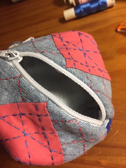 Finished solid blue/solid salmon/denim pouch.