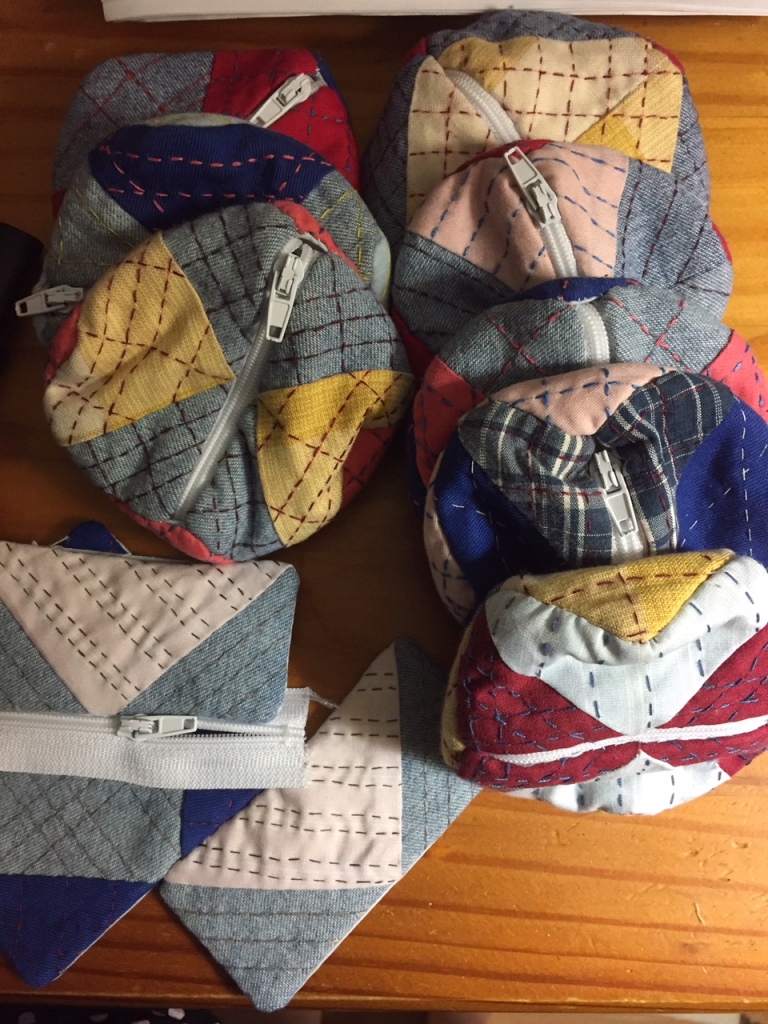 The first 8 completed pouches, and the pieces of the 9th